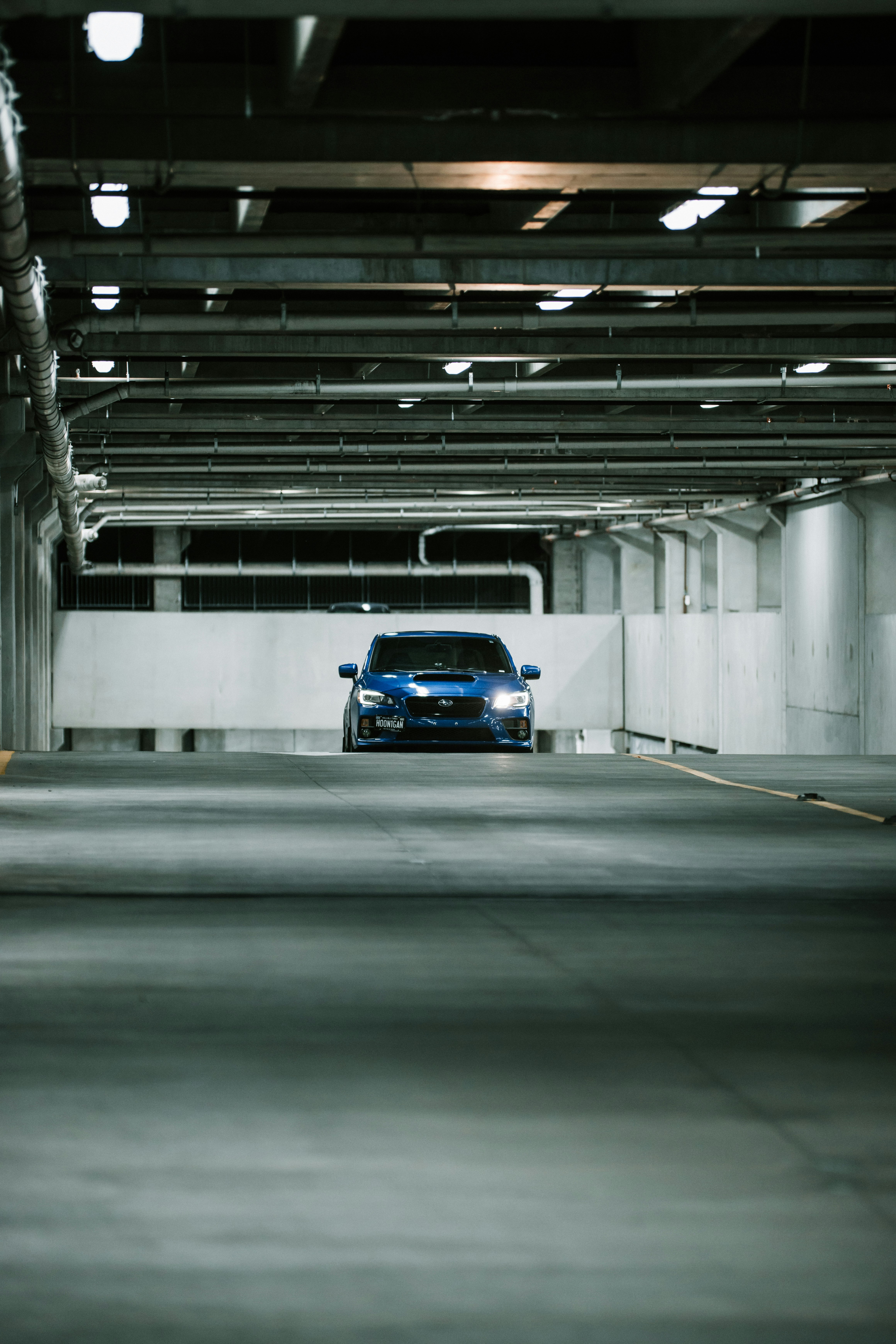 blue car on gray road